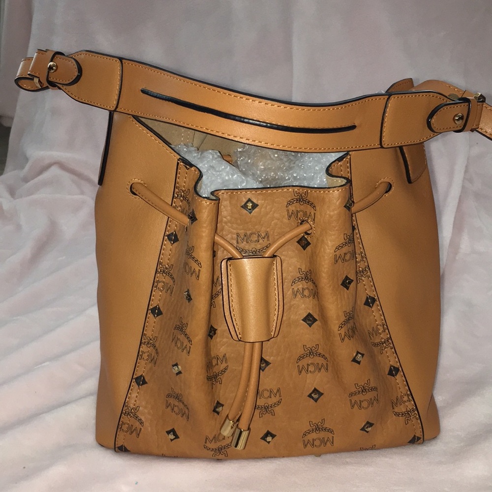 MCM studded bucket purse